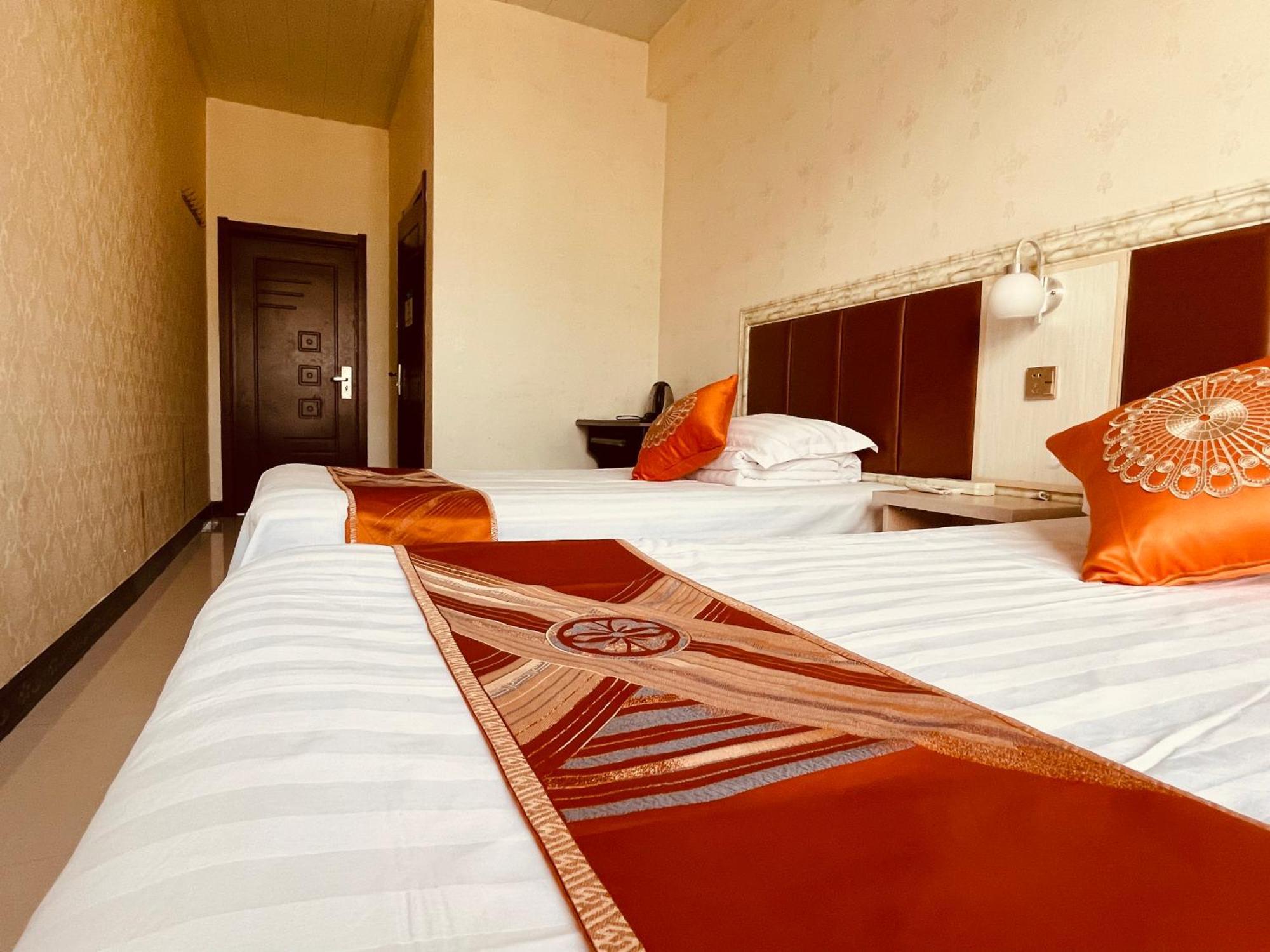 Hotel 哈尔滨机场东方红运宾馆 Zimmer foto