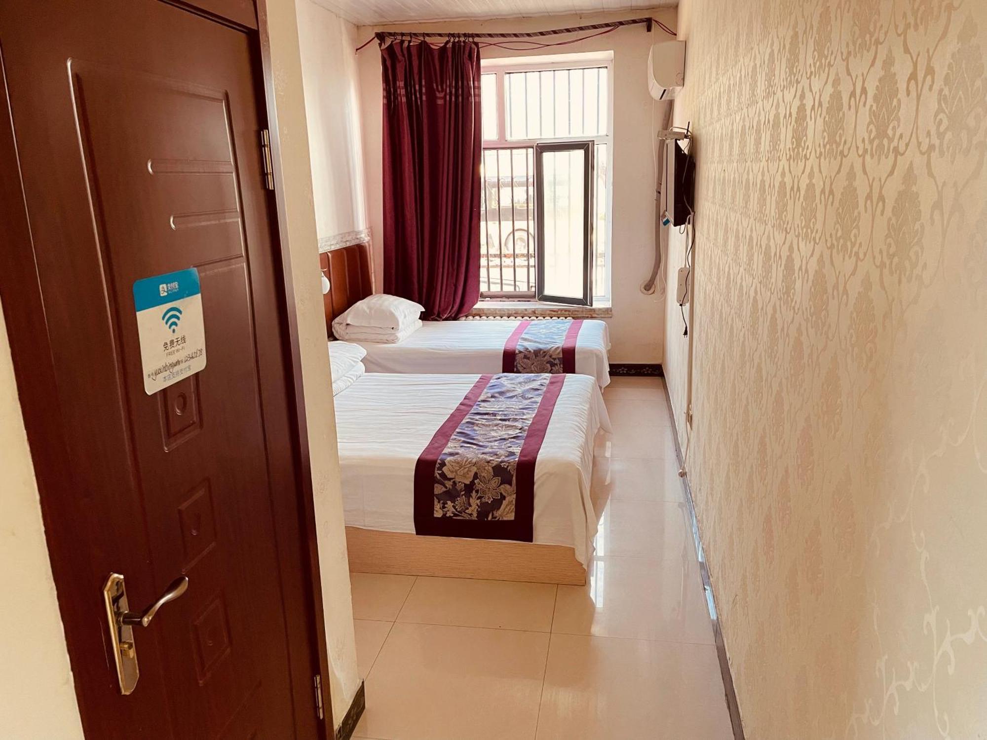 Hotel 哈尔滨机场东方红运宾馆 Zimmer foto