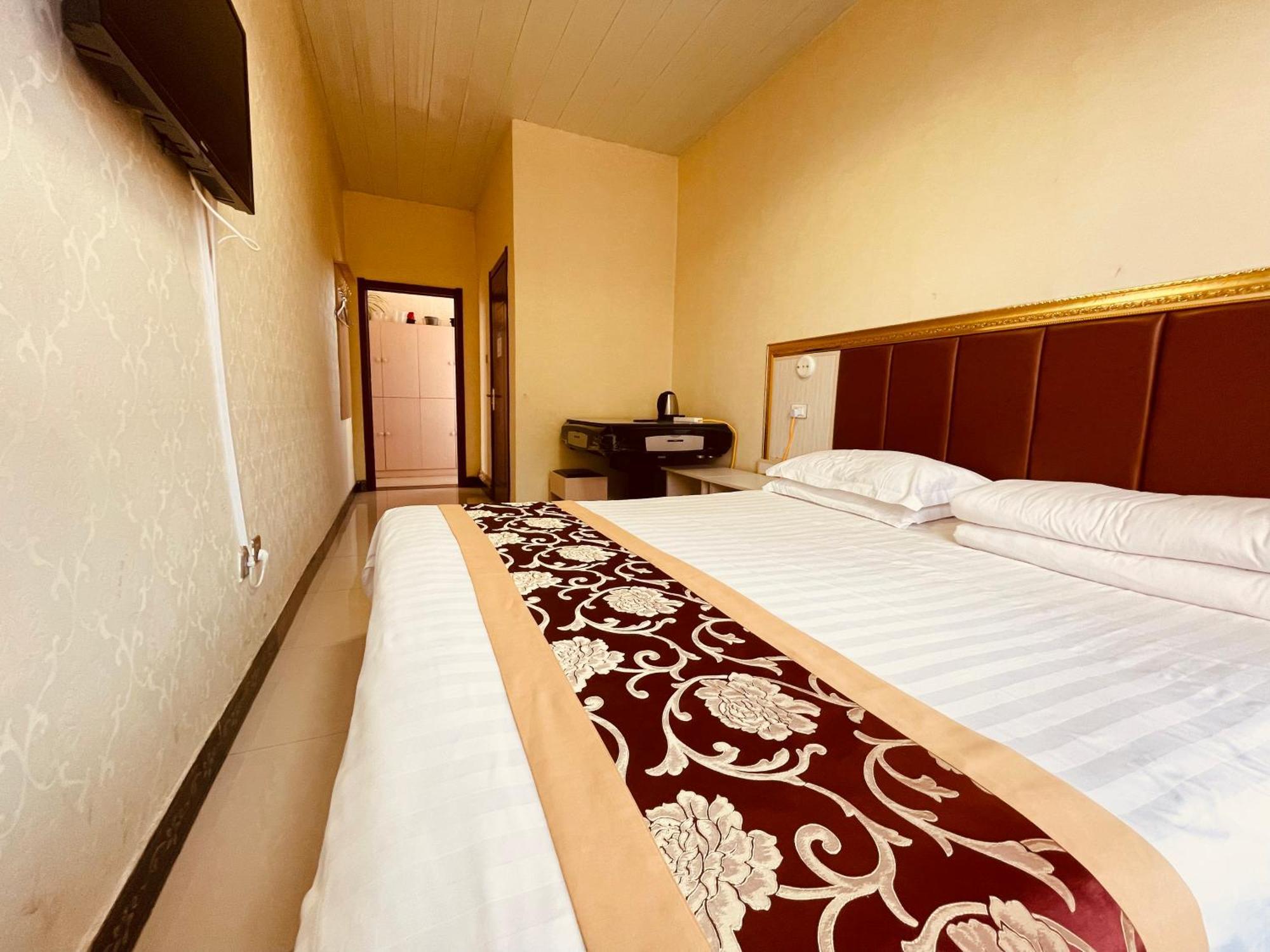 Hotel 哈尔滨机场东方红运宾馆 Zimmer foto